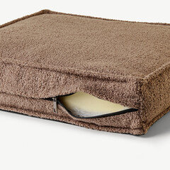 Brown cushion cover showing foam insert and zipper closure
