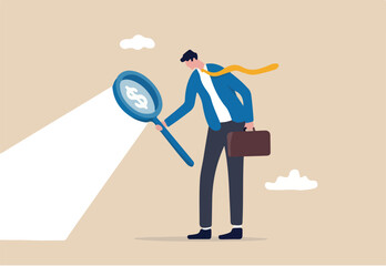 Searching for investment opportunity, stock market research or hidden cost and expense concept, businessman looking through magnifying glass to see dollar money sign search for money. 