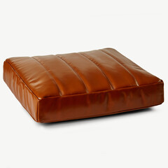 Brown leather pouf resting on white background