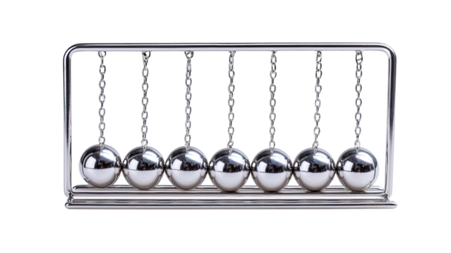 A metallic Newton's cradle, showcasing eight polished steel balls suspended by chains