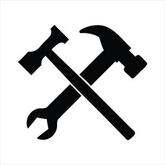 Black silhouette of a hammer and wrench crossed on a white background