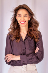 Cropped shot of a cheerful smiling woman standing against isolated background