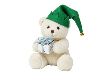 Isolated stuffed toy bear with green elf hat holding gift ready for Christmas holiday