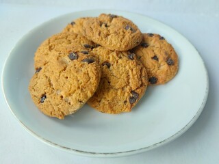 Chocolate flavored dry biscuits isolated on white background, sweet snack and dessert for food photography and culinary design.
