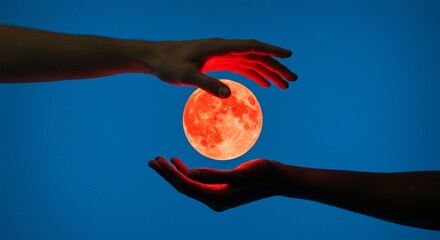 Glowing Orb Between Two Hands Against a Blue Backdrop Red Light