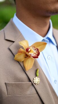 Close-up of a man's lapel flower