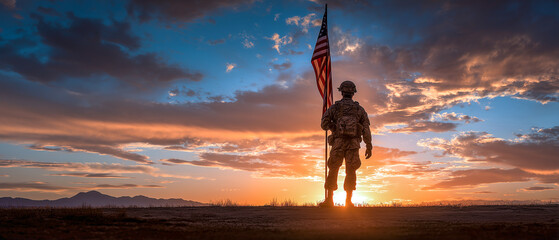 Solemn soldier silhouette holding flag against dramatic sunset sky representing patriotism and sacrifice