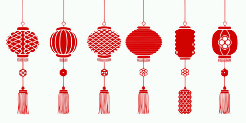 Collection of traditional red chinese lanterns with tassels hanging against a white background