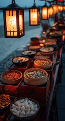 Outdoor food buffet at night under lanterns