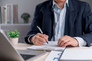 Signature, document Manager writes on contract at modern office to confirm terms and approval,...