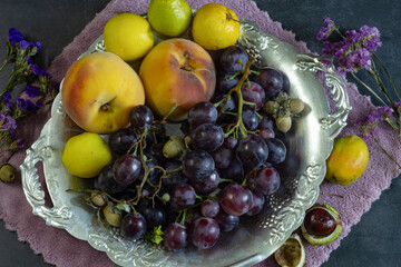 fresh fruits and flowers in a glass bowl, healthy food