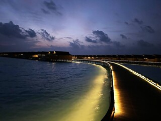 Where the ocean glow and luxury floats - welcome paradise on stilts. Maldives night never looked so magical!