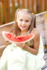 girl eats watermelon laughs summer village nature joy happiness rest August