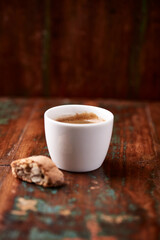 Cup of coffee on rustic wooden background. Soft focus. Copy space	