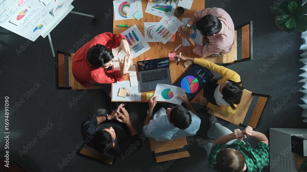 Poster top view of business team working together while talking about financial chart. close up of skilled 