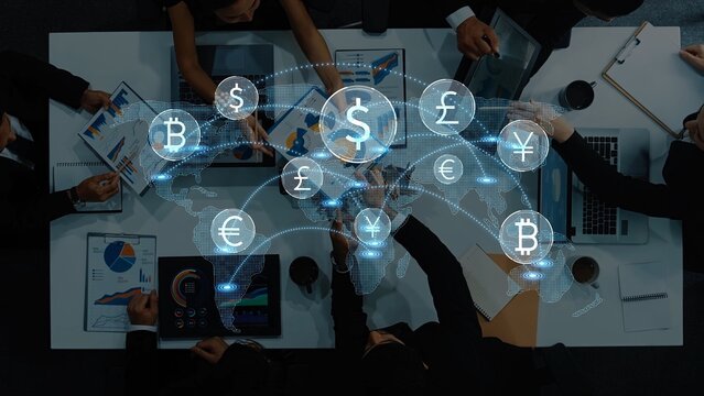 Aerial view of business professionals collaborating on cryptocurrency strategies with digital currency symbols and graphs, symbolizing finance and investment trends. Raster - Powered by Adobe