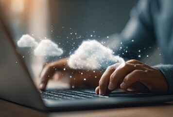 Close-up of hands typing on a laptop with cloud computing concept