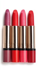 Close-up of four lipstick tubes in varying shades of red and pink