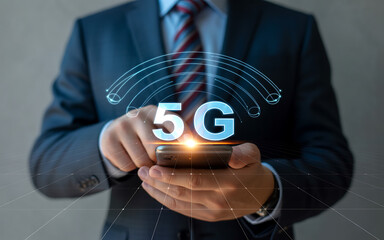 Businessman utilizing smartphone technology with glowing 5g hologram and futuristic connection signals