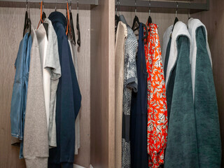 casual wear hanging in a wardrobe
