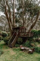 A charming wooden treehouse nestled amongst tall trees, with a peaceful garden setting and outdoor seating.