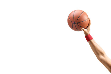 Hand holding a basketball