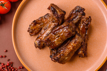 Grilled beef or pork ribs, meat cooked on a barbecue with salt and pepper. Grilled ribs