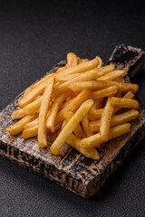 Crispy French fries with sauce, fast food, snack or chips. French fries, takeaway food