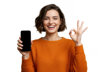 Smiling young woman holding a smartphone and showing an okay gesture isolated on transparent background