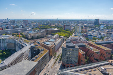 Fototapeta premium City panorama of Berlin with streets, buildings, and parks. The view stretches far to the horizon.