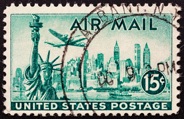 UNITED STATES OF AMERICA - CIRCA 1947.A stamp printed in USA shows Statue of Liberty on the background the skyscrapers of New York, airliner Lockheed Constellation, circa 1947