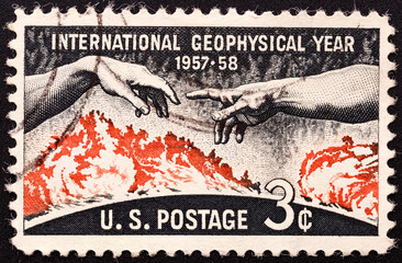 UNITED STATES OF AMERICA - CIRCA 1958. stamp printed by United states, shows Solar Disc and Hands from Michelangelo's Creation of Adam, circa 1958