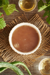 Homemade flax seed gel, aloe vera, argan oil, apple cider vinegar and nettle - ingredients for diy shampoo. Alternative no poo haircare.