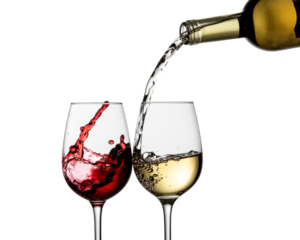 red and white wine poured from a bottle into wine glass on white background, isolated