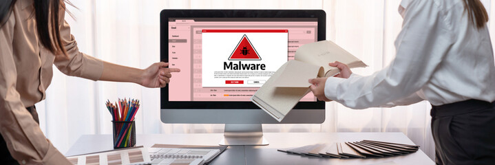 Cyber attacking concept. Malware alert showing on computer screen display scam and threat detection...