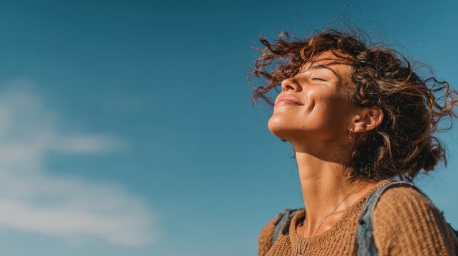 woman smiling looking up to blue sky taking deep breath celebrating freedom positive human emotion face expression feeling life perception success peace mind concept free happy girl enjoying nature n