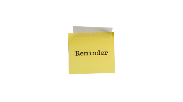 A Reminder note on a yellow sticky note.