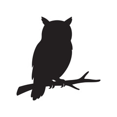 Silhouette of an Owl Perched on a Branch An Enigmatic Creature of the Night Observing its Surroundings