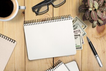 Opened Notebook Lying Over Office Table Background.