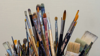 Various professional used paint brushes, selective focus