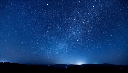stars fall in the dark blue night sky