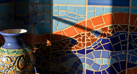 Decorative Ceramic Pottery and Artistic Mosaic Tile Work in Dramatic Sunlight