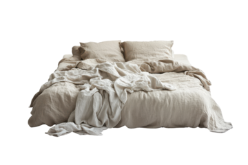 Cozy unmade bed with textured linens isolated on transparent background. Cozy modern bedroom setting with unmade bed and neutral colored bedding isolated on white background.
