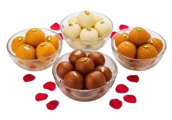 Assortment of indian sweets in glass bowls with rose petals scattered around on a plain surface on transparent background