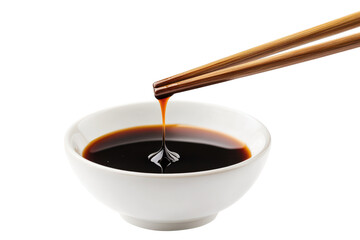 Chopsticks dipping into soy sauce in a white bowl isolated on transparent background. Delicious dumpling held with chopsticks dripping soy sauce isolated on white background.