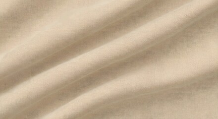 Close up of beige fabric with diagonal folds creating soft shadows and subtle texture detail visible
