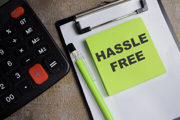Concept of Hassle free write on sticky notes isolated on Wooden Table.