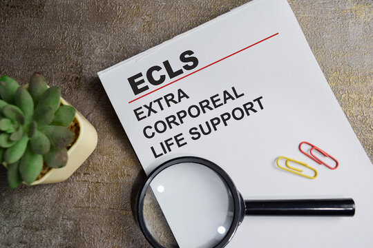 Concept of ECLS - Extra Corporeal Life Support write on book isolated on Wooden Table.