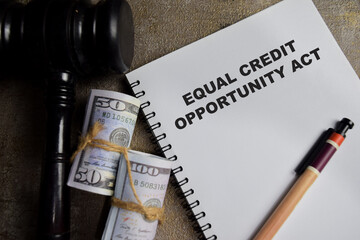Concept of equal credit opportunity act write on book isolated on Wooden Table.