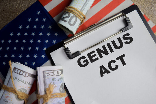 Concept of genius act with the United States flag write on clipboard isolated on Wooden Table.